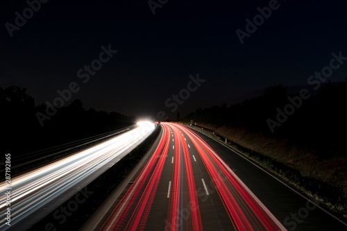 German freeway with car lights at night 
