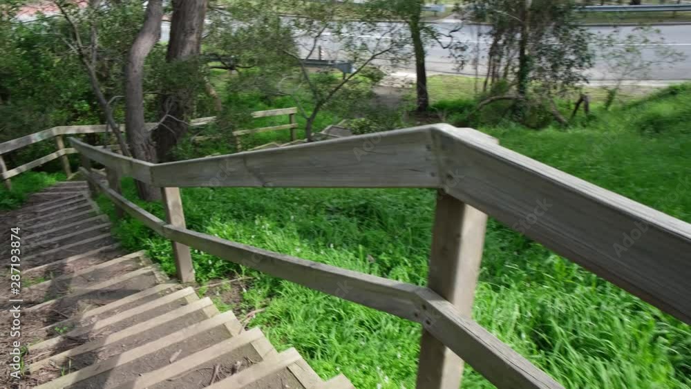 POV walk down wooden stairs in nature reserve in Australia POV walk down wooden stairs in nature reserve in Australia