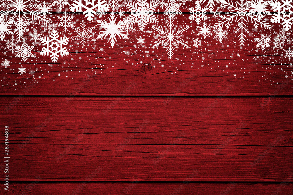 Red Christmas winter background with snowflakes on wood - obrazy, fototapety, plakaty 
