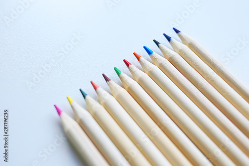 Colorful wooden eco pencils on white table