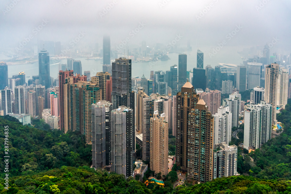 Naklejka premium Hong Kong skyscapes and skyline in heavy haze or smog, view from Victoria Peak