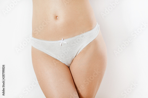 Lower body - Beautiful slim body of woman in lingerie, female white panties