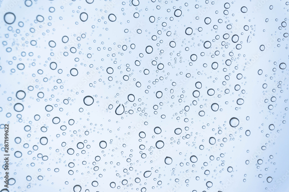 Blue Drops water drops on glass surface as background. Blue Drops water drops on glass surface as background.