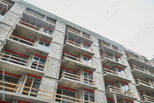 Apartment building block of flats under construction in a city urban area photo