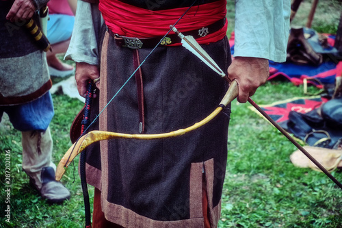 Archer Buryat tribe stands with a bow in his hand. Reconstruction of the life of the nomadic peoples of Russia. Weapons for hunting and war Buryat tribes.