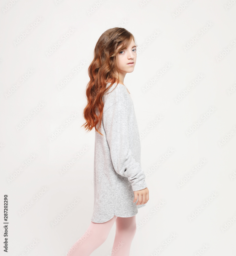 Beautiful little fashion model girl on white background. Portrait of cute smiling girl Beautiful little fashion model girl on white background. Portrait of cute smiling girl