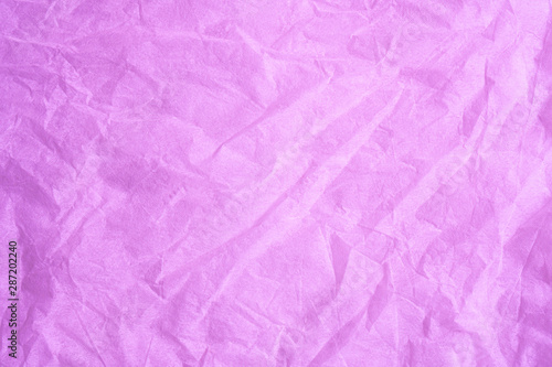 Pink color creased paper tissue background texture.