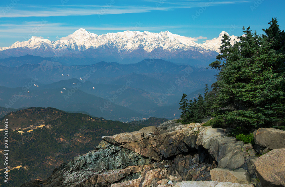 Garhwal Himalayan mountain range as viewed from Binsar wildlife sanctuary Uttarakhand India.