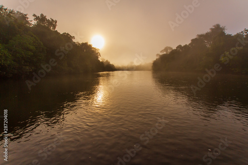 Sunrise with a fog in the cristalino's river, Amazon Rainforest - Mato Grosso, Brazil