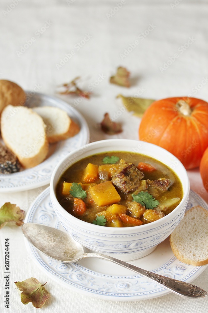 thick soup with pumpkin and beef. hearty autumn dish thick soup with pumpkin and beef. hearty autumn dish