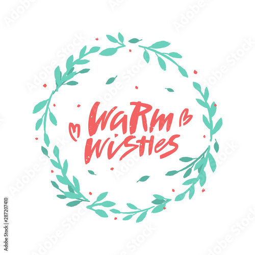 Warm wishes vector brush lettering in floral wreath. Handwritten Christmas typography print.  Hand drawn decorative design element.