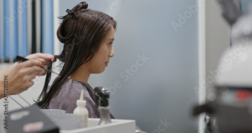 Asian woman with hair coloring in process