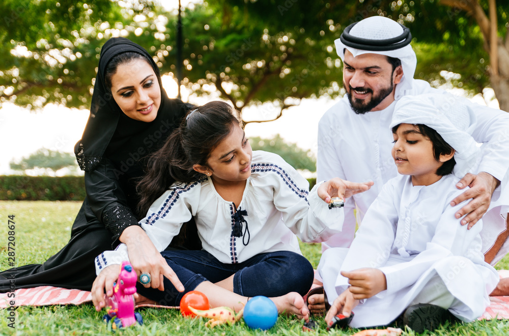 Arabian family spending time in a park Arabian family spending time in a park