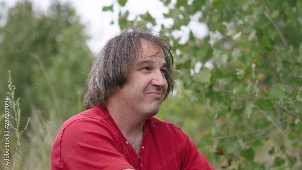 Depressed man outdoors in nature talking to himself. Depressed man outdoors in nature talking to himself.
