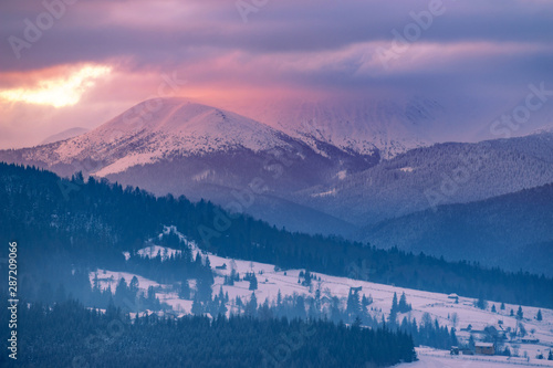 winter landscape. mountains on horizon  covered with snow