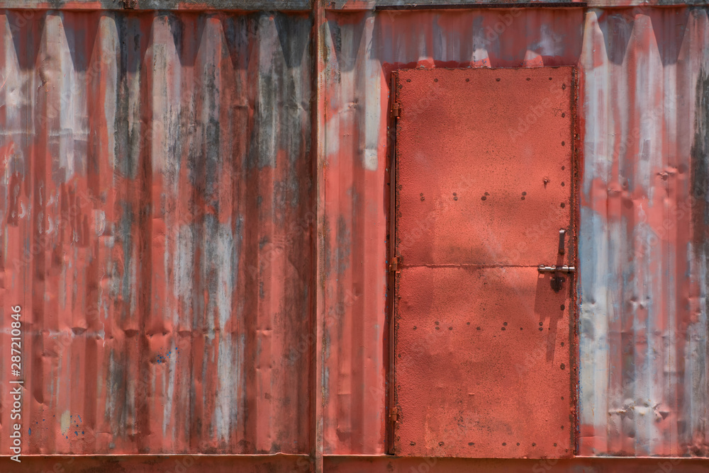 The old red texture of the container with the door, Vintage background.