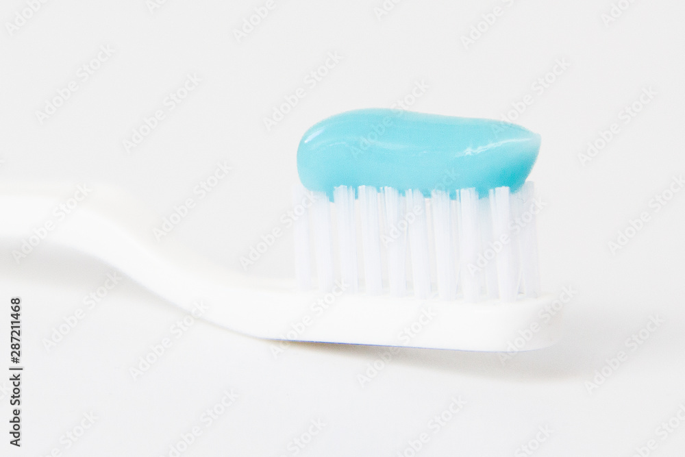 Toothbrush with toothpaste on white background Toothbrush with toothpaste on white background