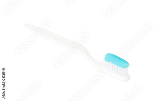 Toothbrush with toothpaste on white background