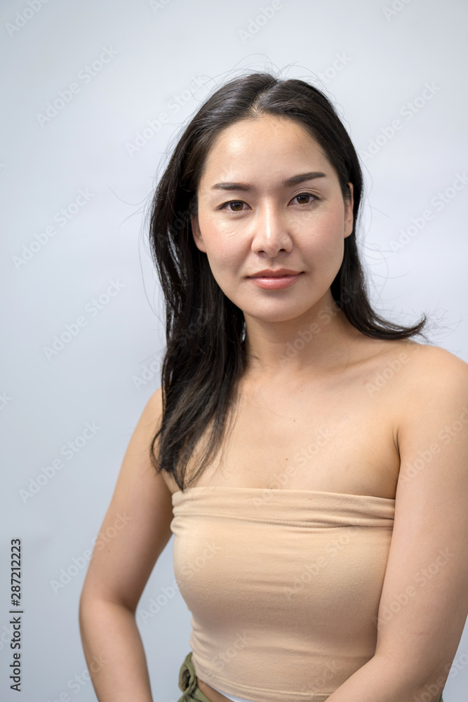 Asian woman beauty face closeup portrait. Beautiful attractive mixed race Chinese  Asian / Caucasian female model with perfect skin isolated on white  background Photos | Adobe Stock