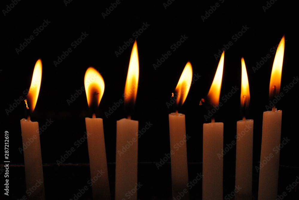 candles on black background candles on black background