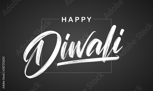 Handwritten calligraphic brush lettering of Happy Diwali on chalkboard background