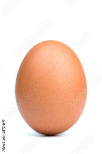 Single brown eggs isolated from white background.