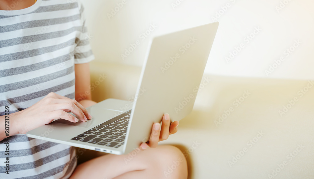 Women hands typing on laptop keyboard. Working or shopping online concept. Women hands typing on laptop keyboard. Working or shopping online concept.