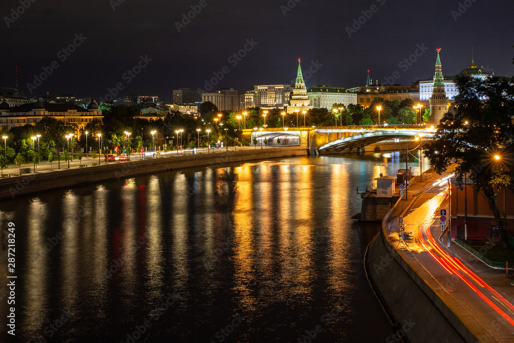 Night view to the Moscow river, Kremlin, Vodovoznaya and Borovitskaya towers from the Patriarshiy bridge