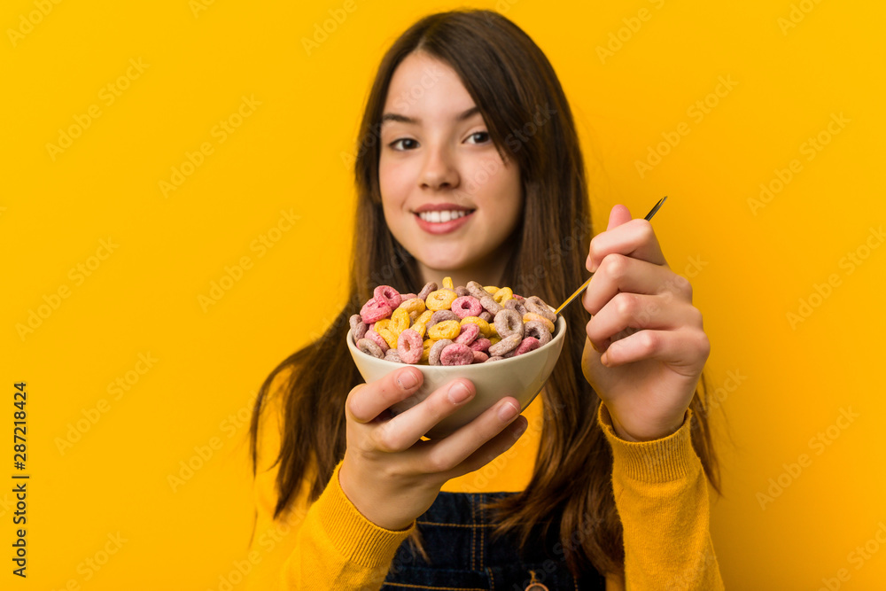 Little caucasian girl holding a cereal bowl Little caucasian girl holding a cereal bowl