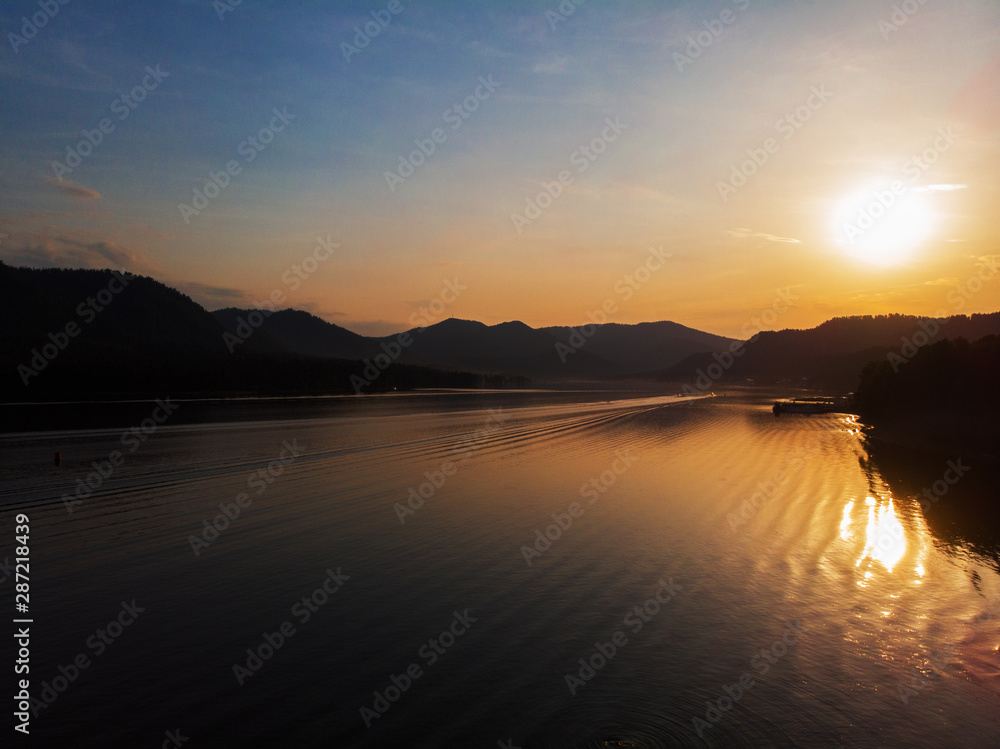 Sunset on Teletskoye lake in Altai mountains, Siberia, Russia. Drone shot.