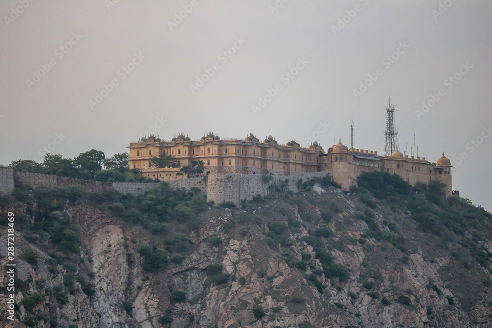View of the Nahargarh fort over the rooftops of the Pink City of Jaipur, India