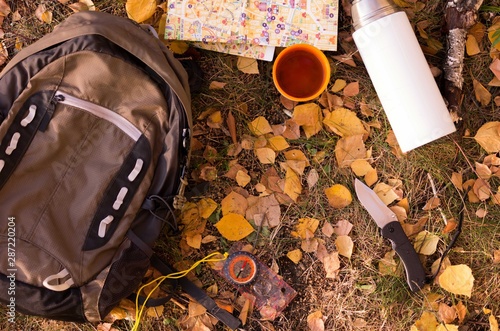 Travel accessories and autumn mood. Travel backpack and attributes. photo