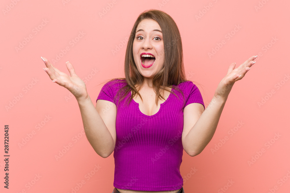 Young hispanic woman against a pink wall celebrating a victory or success, he is surprised and shocked. Young hispanic woman against a pink wall celebrating a victory or success, he is surprised and shocked.
