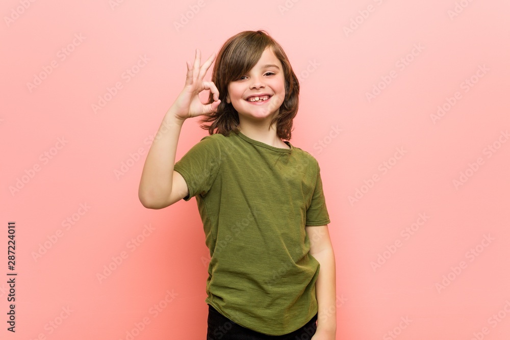 Little boy cheerful and confident showing ok gesture. Little boy cheerful and confident showing ok gesture.