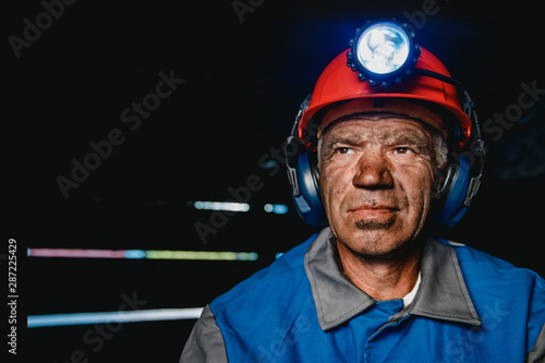 Miner after working on coal mine. Concept industrial engineer