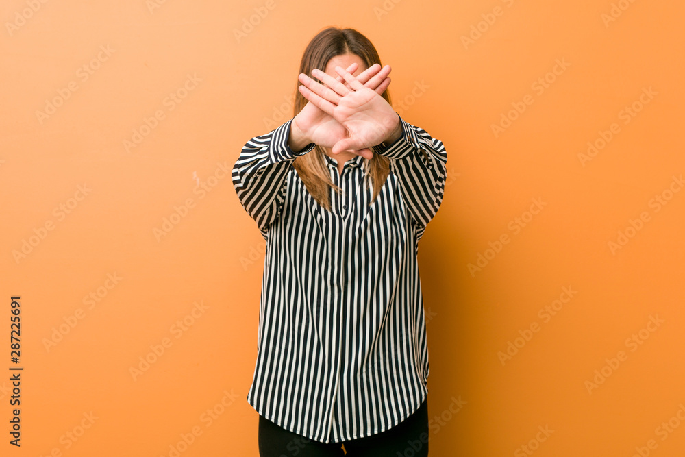 Young authentic charismatic real people woman against a wall doing a denial gesture Young authentic charismatic real people woman against a wall doing a denial gesture