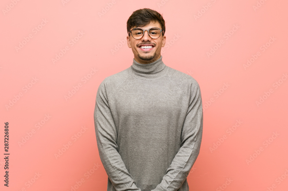 Young smart student man happy, smiling and cheerful. Young smart student man happy, smiling and cheerful.