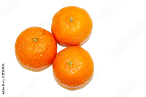 Three mandarins isolated on white background and space for your text.