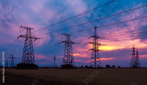  high-voltage power lines at sunset.