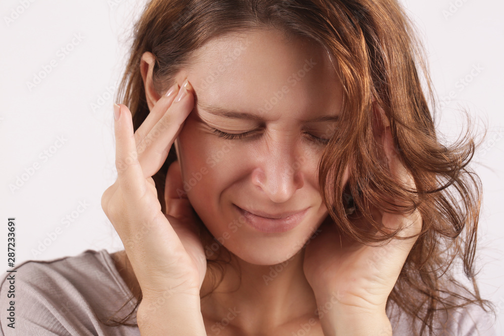 Studio shot of a young woman suffering from headache Studio shot of a young woman suffering from headache
