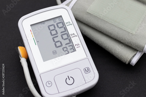 Automatic blood pressure monitor with low blood pressure on a bl photo
