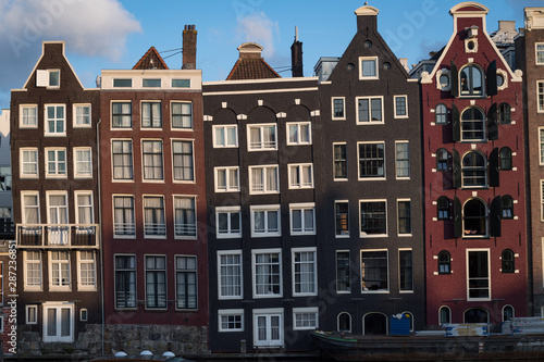 Amsterdam, Netherlands - August 2019: iconic crooked former warehouses now apartmetns in Amsterdam