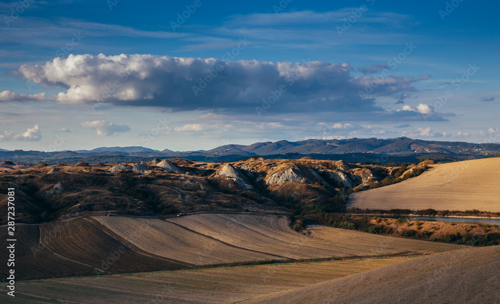 Fototapeta premium Rolling hills in autumn after harvest.