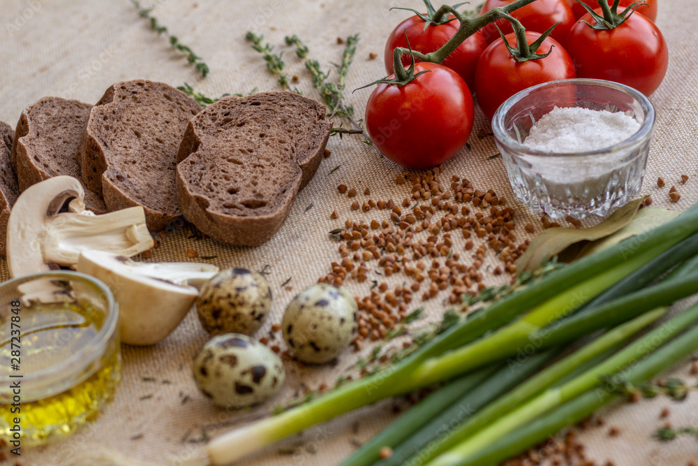 bread composition with herbs and vegetables on a baker's table bread composition with herbs and vegetables on a baker's table