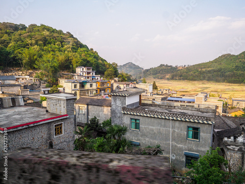 Countryside landscape with agriculture between Luoping and Duoyihe river in Yunnan province China. photo