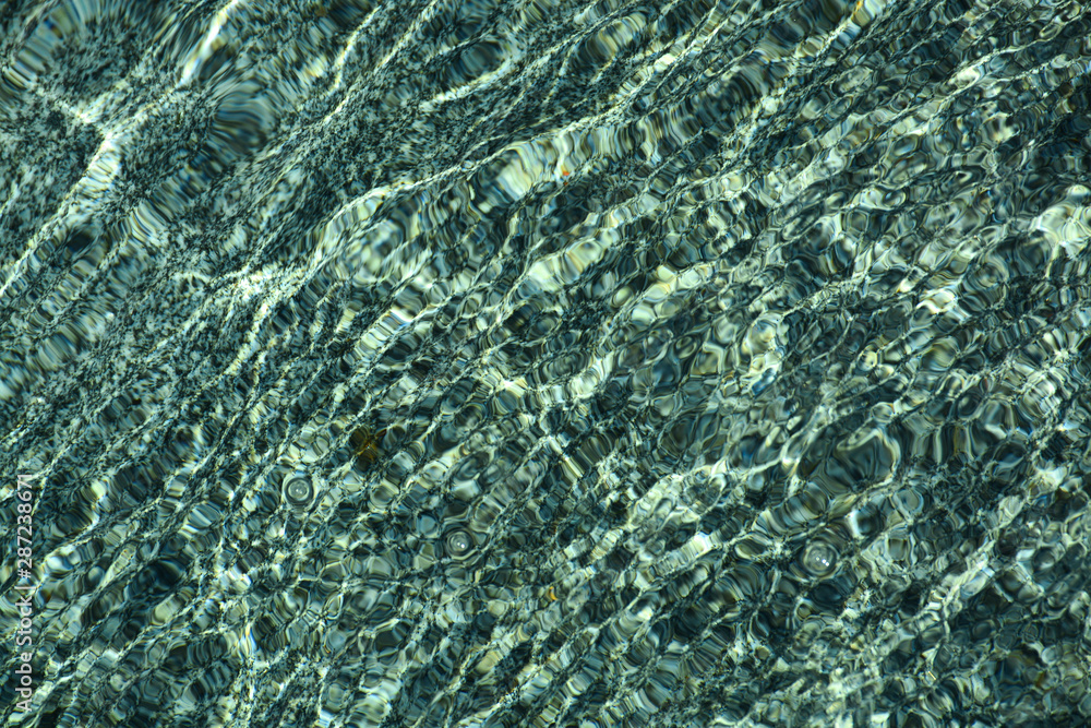 Natural granite under water. Waves create a unique pattern. Natural granite under water. Waves create a unique pattern.