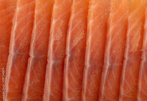 Thin Slices of Raw Salmon Fillet Texture Background