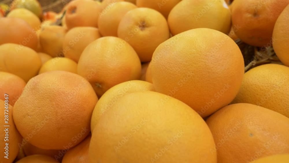 Fresh Oranges Background. close-up. oranges on the counter in the supermarket Fresh Oranges Background. close-up. oranges on the counter in the supermarket