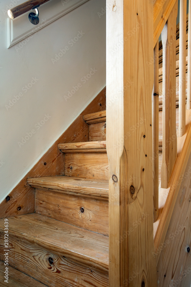 Clean and new wooden staircase in modern home interior close-up Clean and new wooden staircase in modern home interior close-up