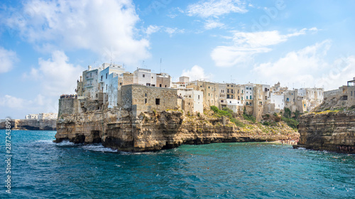 Panoramic spring cityscape of Polignano a Mare town, Puglia region, Italy, Europe. Superb sunrise view of Adriatic sea. Traveling concept background.